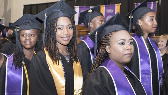 A line of graduates at Wiley graduation ceremony